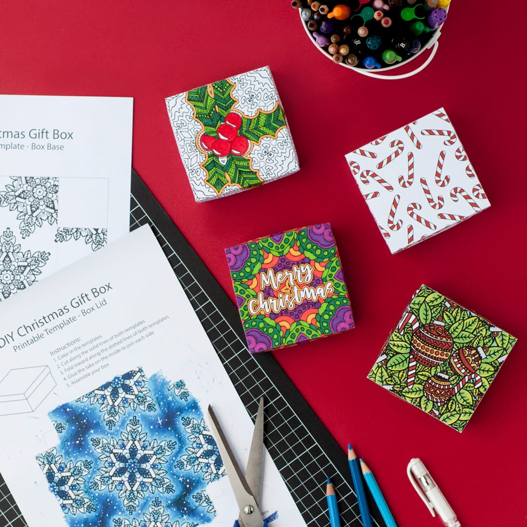 Make a paper gift box for Christmas with this template and tutorial by Sarah Renae Clark. There are 6 different designs to color in! What a great DIY Christmas gift | Check it out at https://sarahrenaeclark.com/christmas-gift-box
