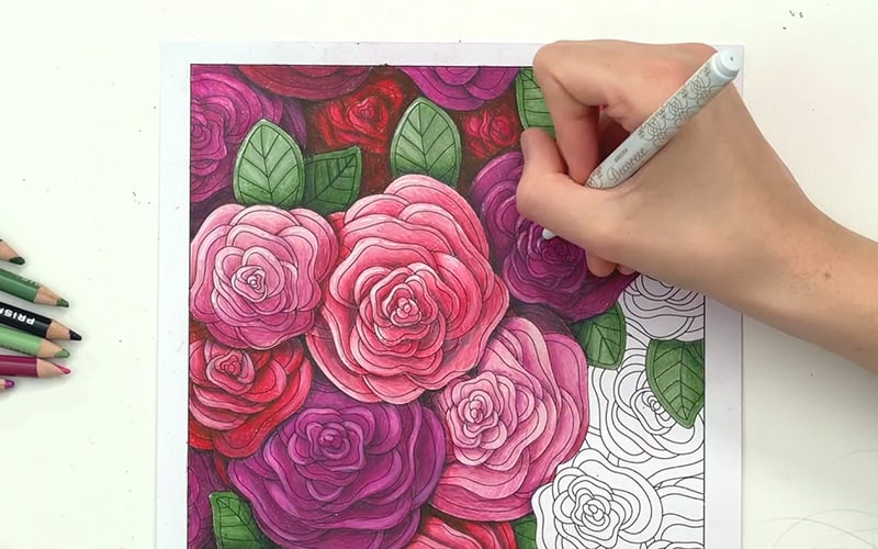 Adding highlights with the Sakura Decorese white gel pen on a coloring page