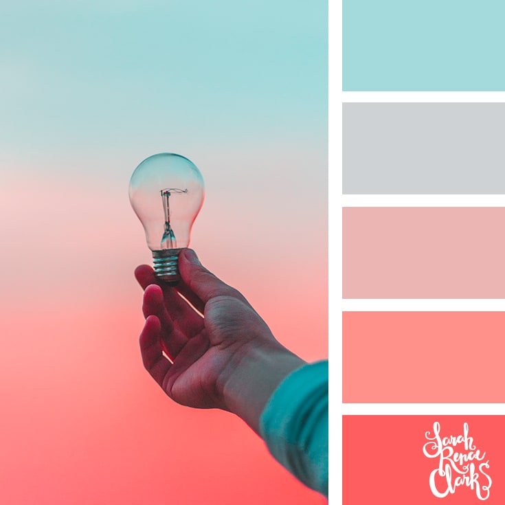 Color Palette 430 a lightbulb being held up by a hand in front of a sunset
