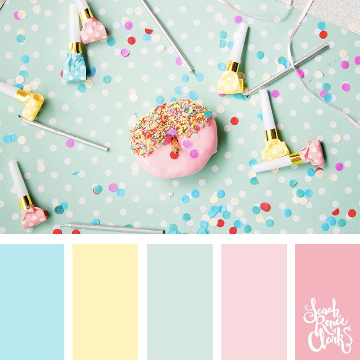 Pastel Toned Color Palette 385 - A pastel pink iced donut with sprinkles on a dotted party table cloth, surrounded by pastel party whistles and candles.