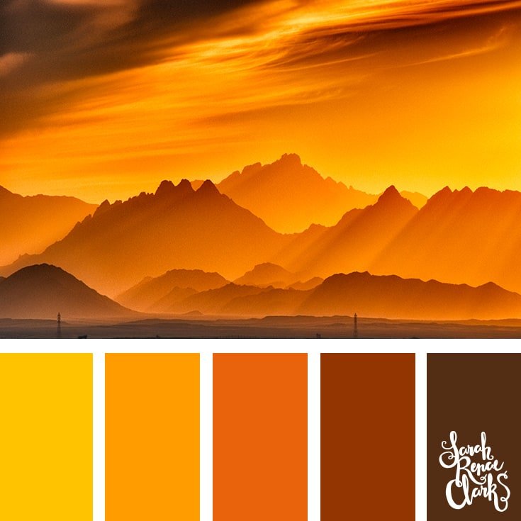 Color Palette 421 - A golden sunset throwing sunbeams over a misty mountain range