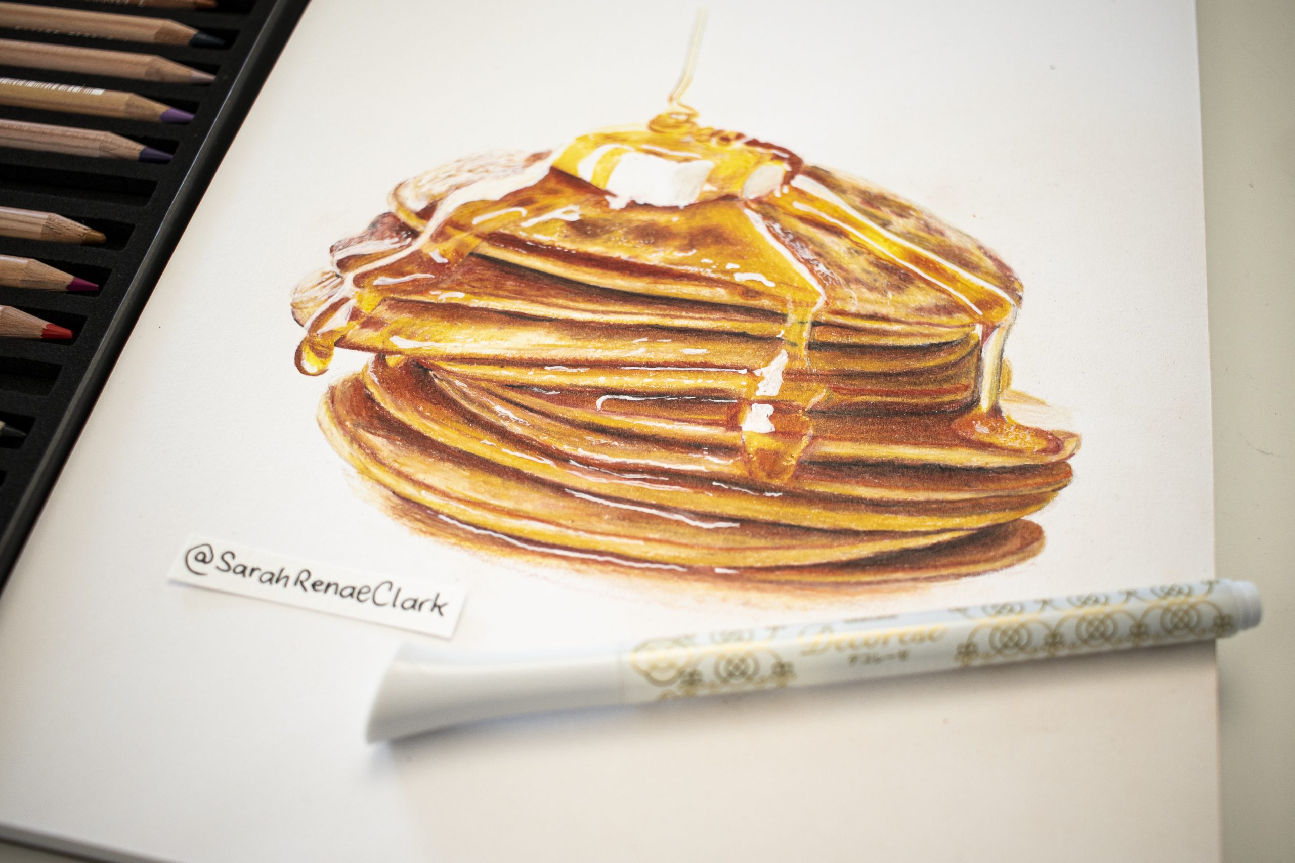 A colored pencil drawing of a stack of pancakes