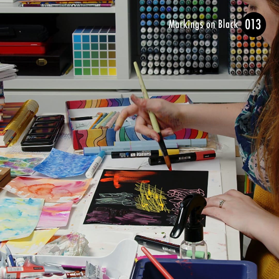 Create markings on Black with paint or markers to make the colours stand out in your mixed media art.