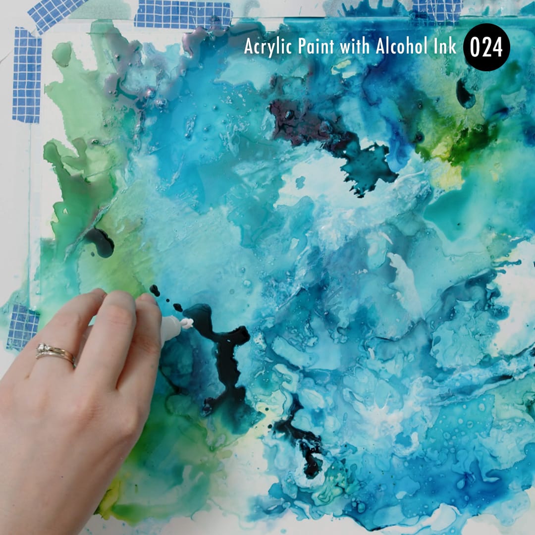 mixing acrylic paint and alcohol ink to create a cool texture for my mixed media art.