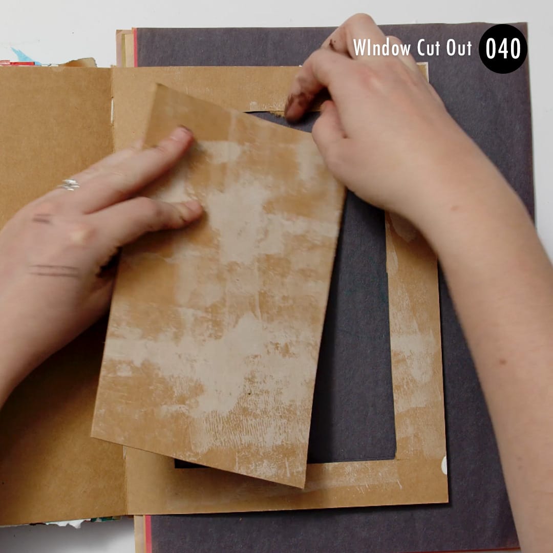 Cut a window out of your page to find the secret on the other side in your mixed media art journal